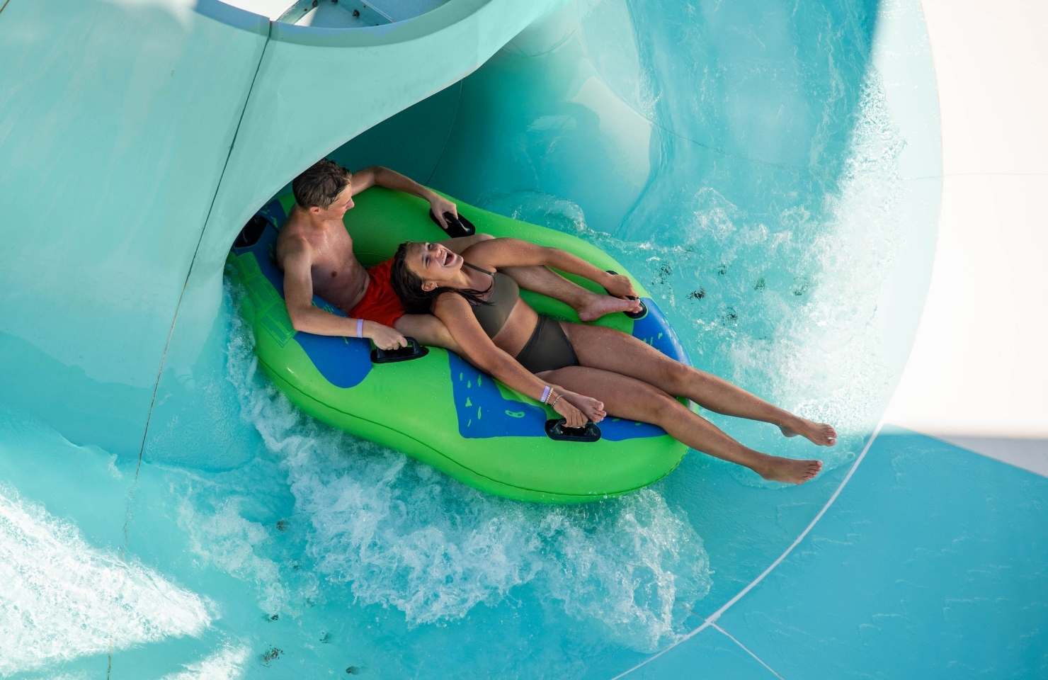 couple having fun in a water slide 