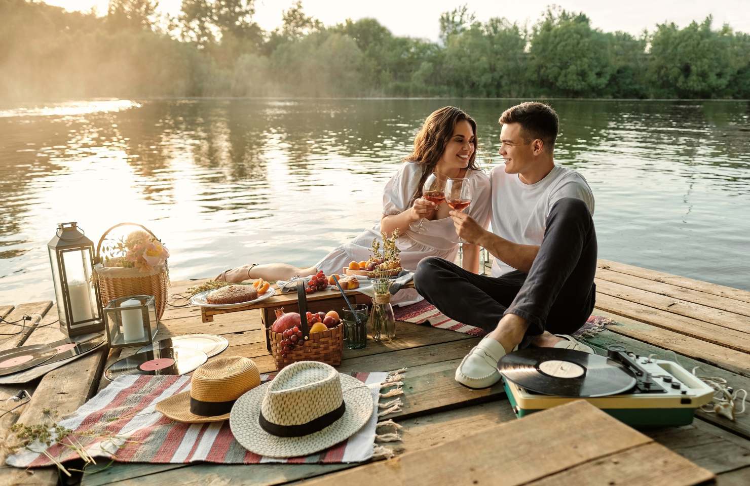 a couple enjoy a picnic in the sun