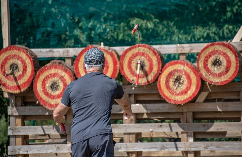 someone doing axe throwing as an amsterdam stag do activity