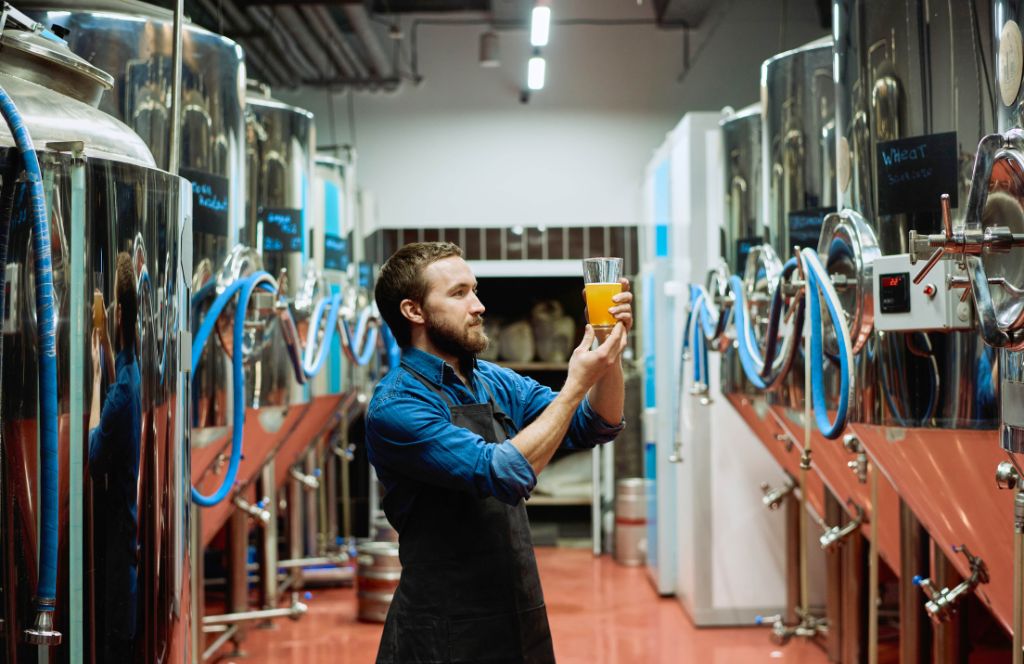 a man enjoys a tour of a brewery as part of a gift experience for him