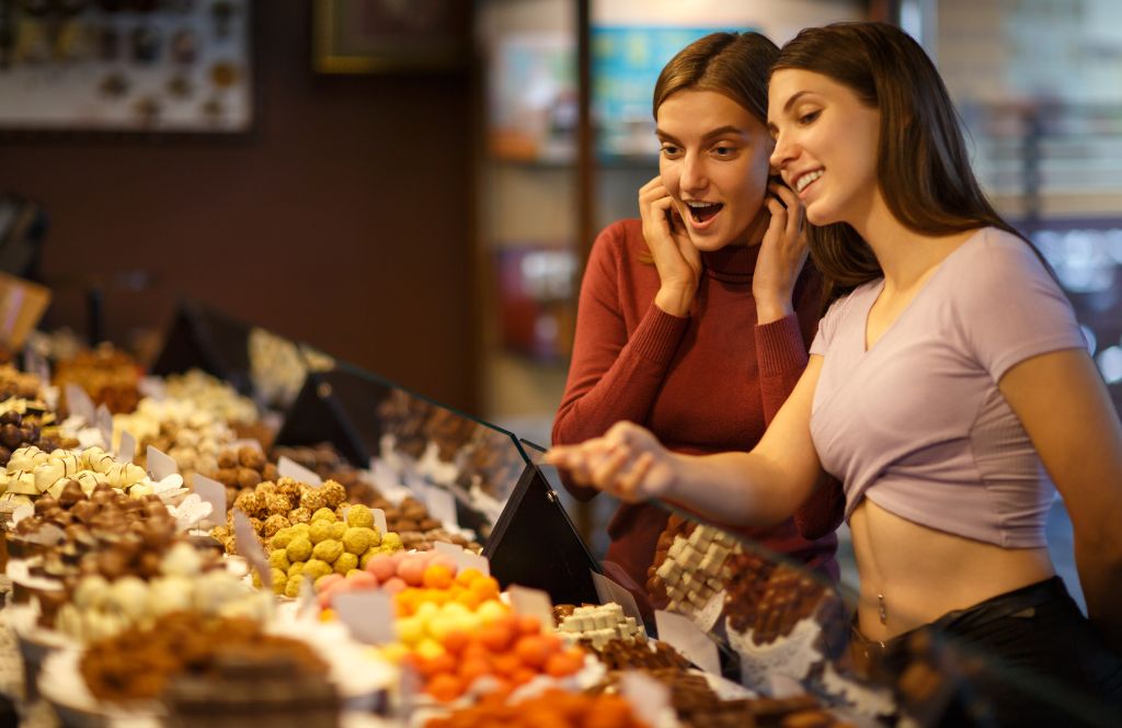 two girls enjoy a chocolate making amsterdam as part of one of the best amsterdam hen do activities