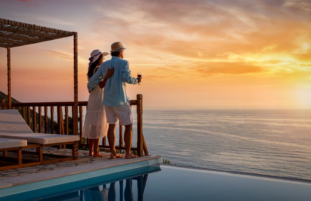 a couple on their honeymoon look out on to sea