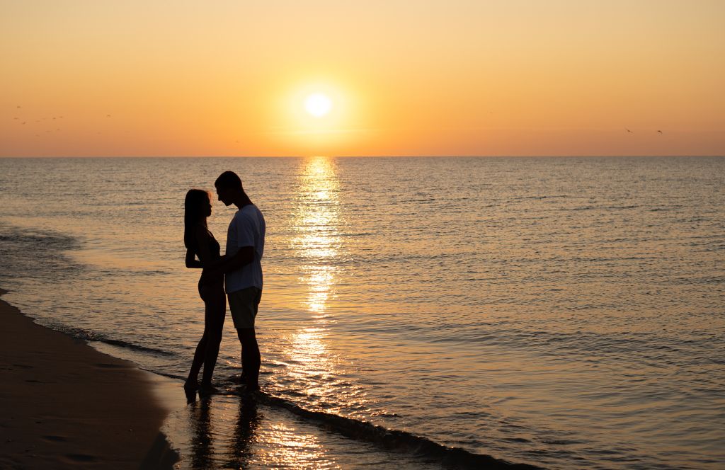 a couple on the beach on their honeymoon