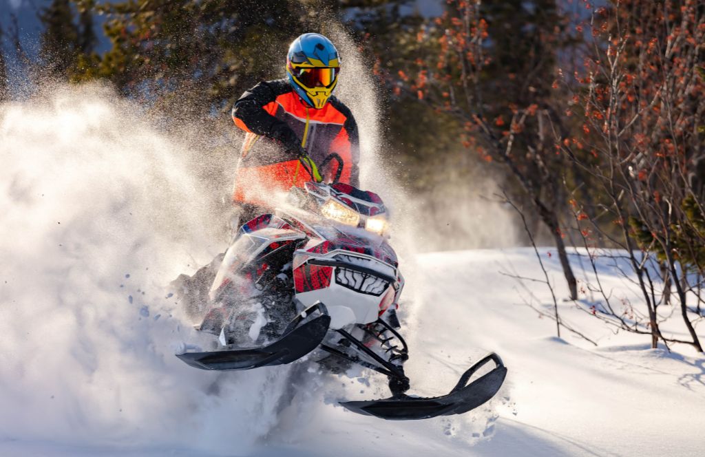 one of the best gift experiences for him is a snowmobile adventure