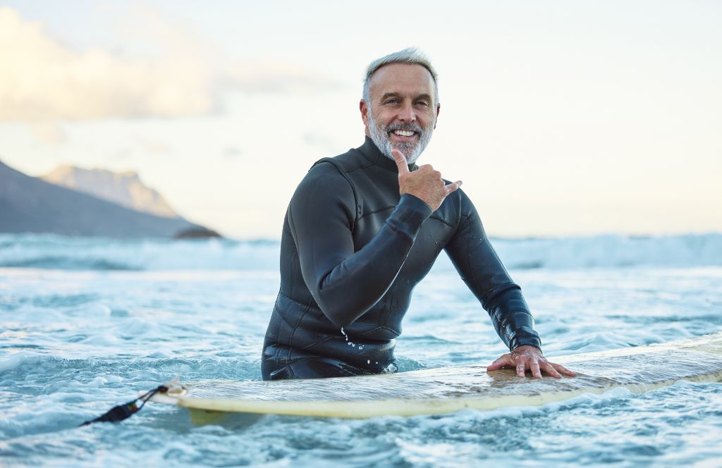 a man enjoys one of the best gift experiences for him - a surfing lesson in tenerife