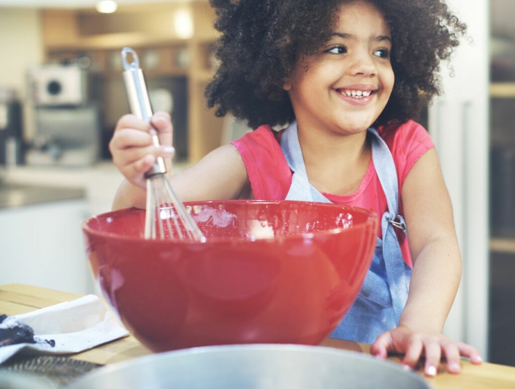 a child enjoys a kids cooking class