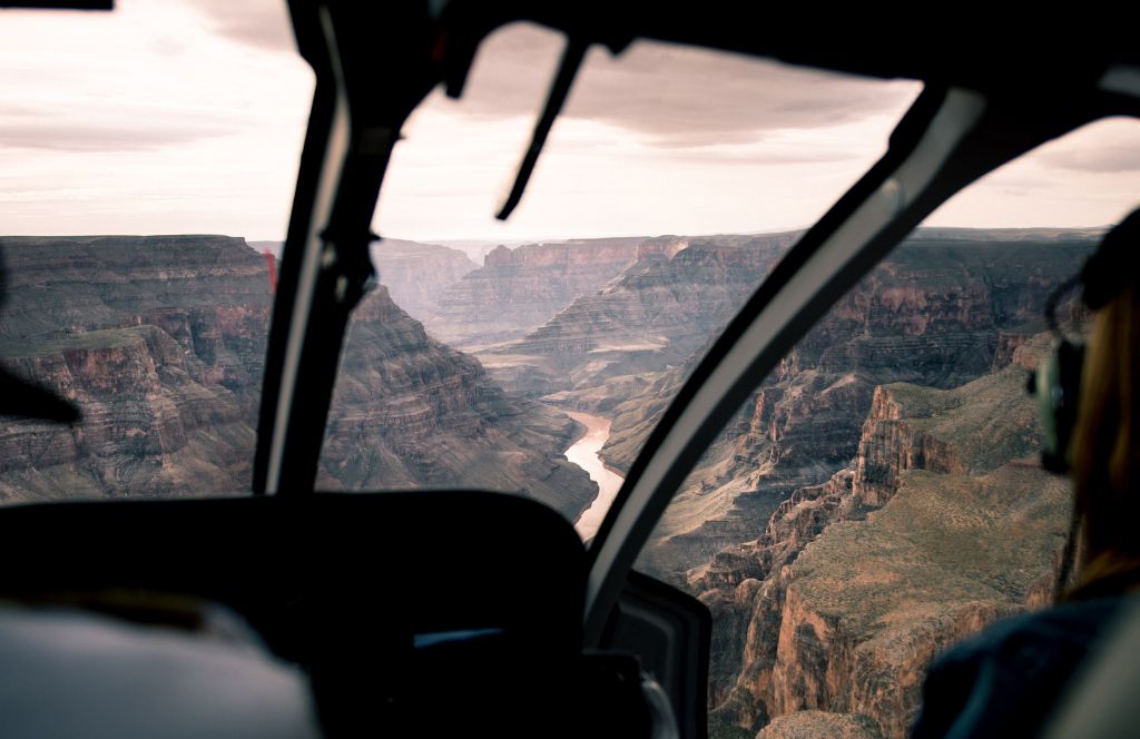 a woman enjoys a helicopter ride as a sister experience gift