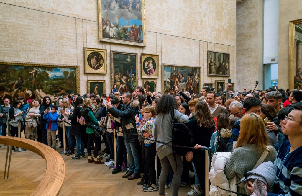 visitors in the louvre - one of the best museums in paris