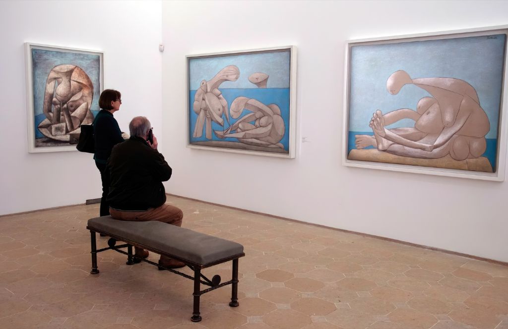 visitors look at rare art in the picasso museum paris