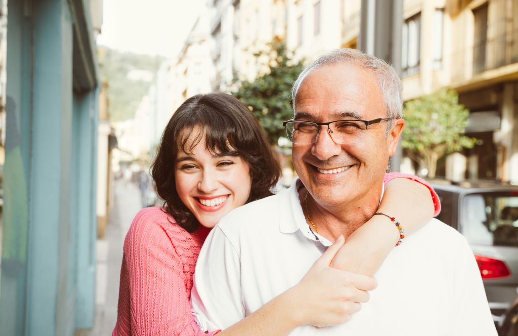 father and daughter smile on father's day 2024