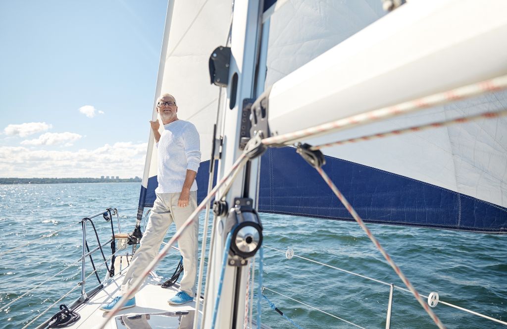 a man enjoys a fathers day experience sailing on a yacht
