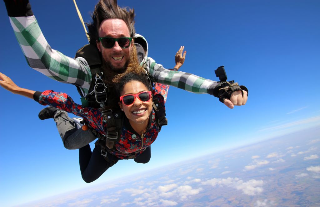 gift a skydiving experience as one of the most unusual birthday experiences for him
